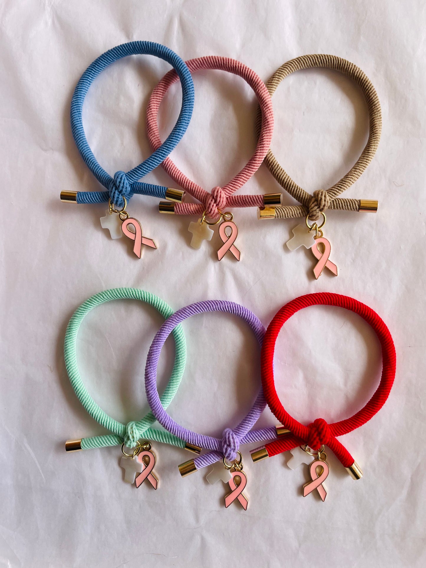 Pulsera solidaria nudo cruz nacarada comunión