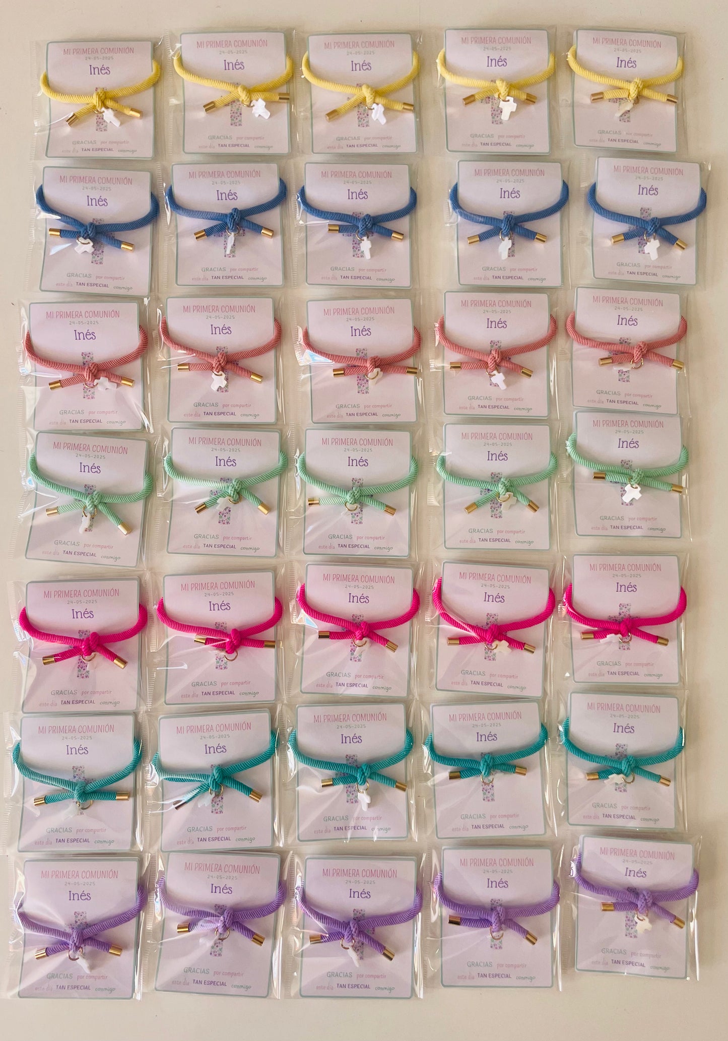 Pulsera solidaria nudo cruz nacarada comunión