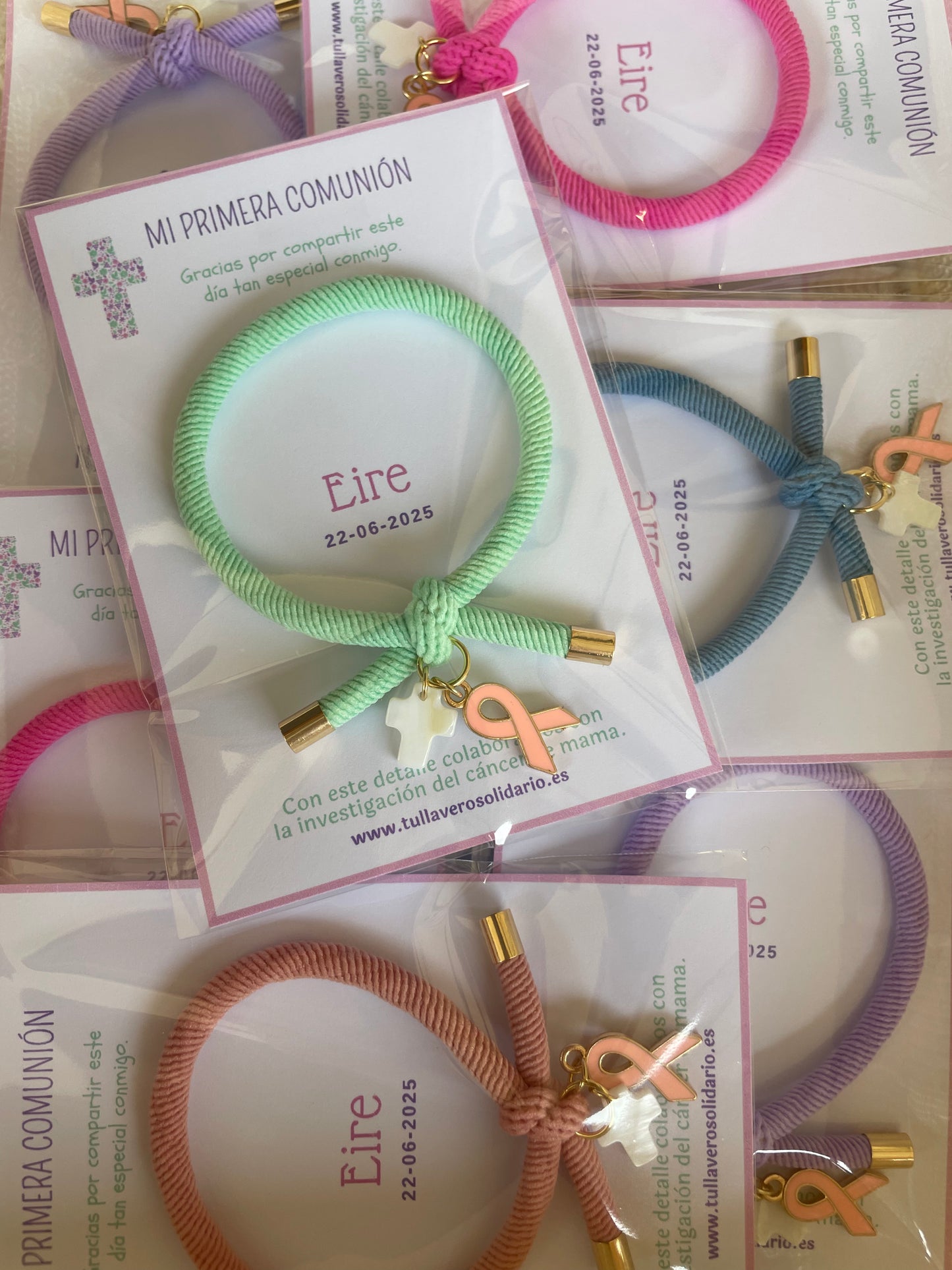 Pulsera solidaria nudo cruz nacarada comunión
