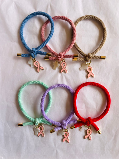 Pulsera solidaria nudo cruz nacarada comunión